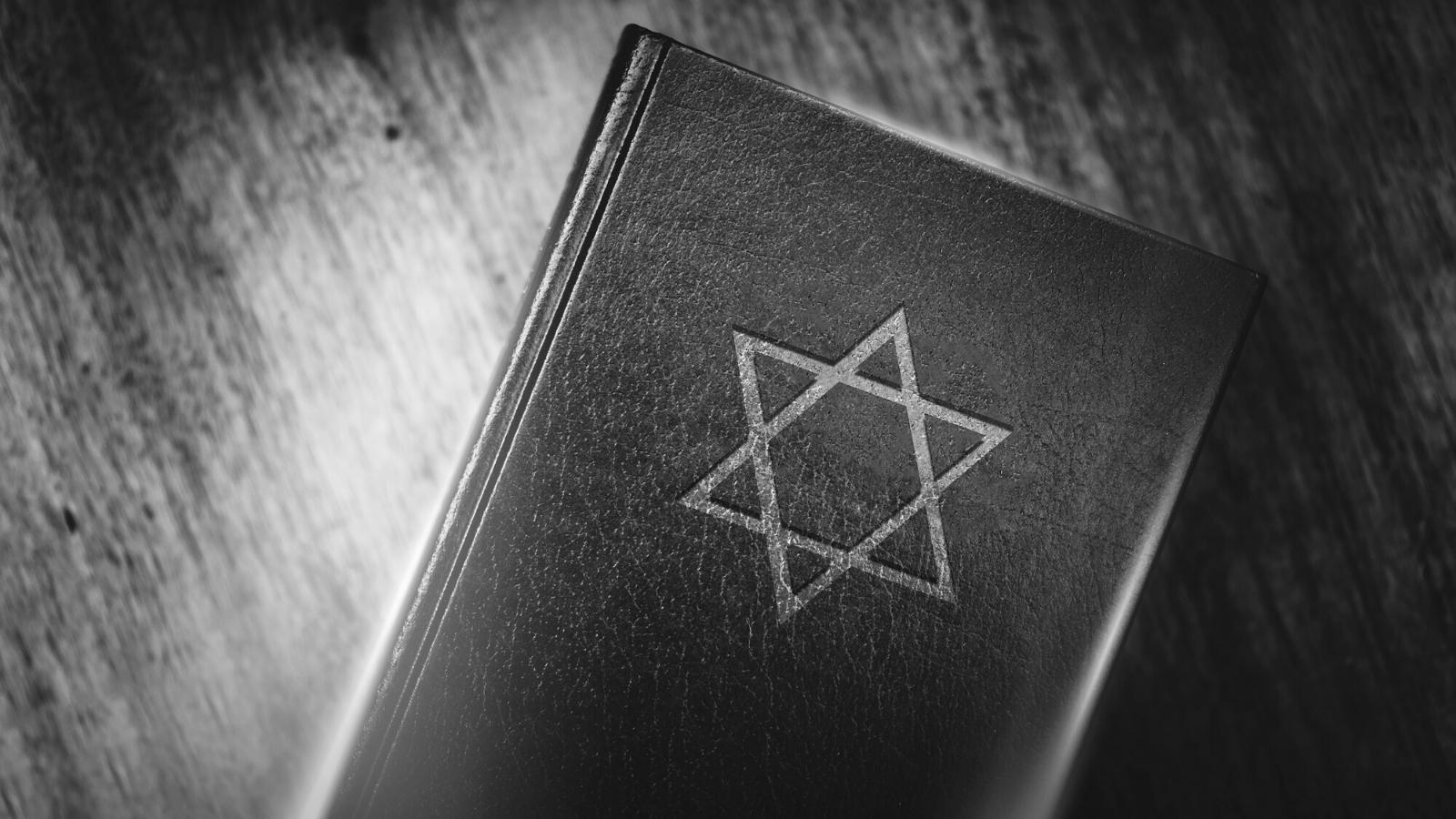 Ancient book with Judaism star