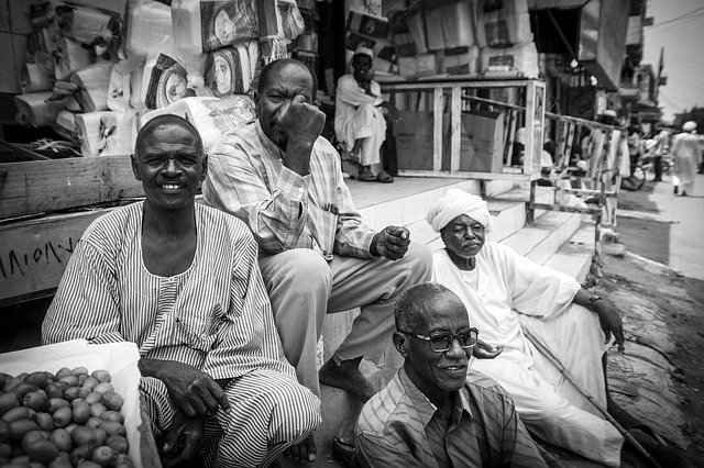 Friends at a market in El Fasher